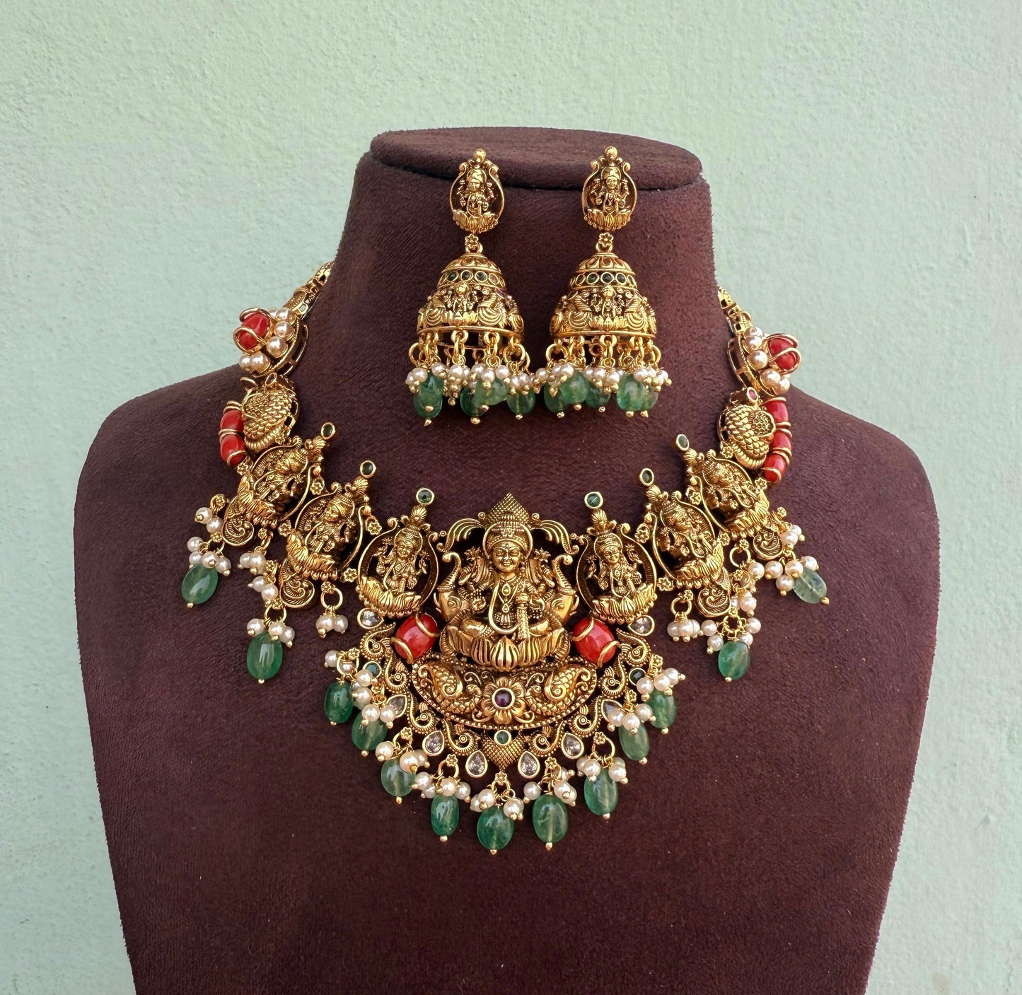 Gold look alike coral lakshmi devi necklace with jhumkas