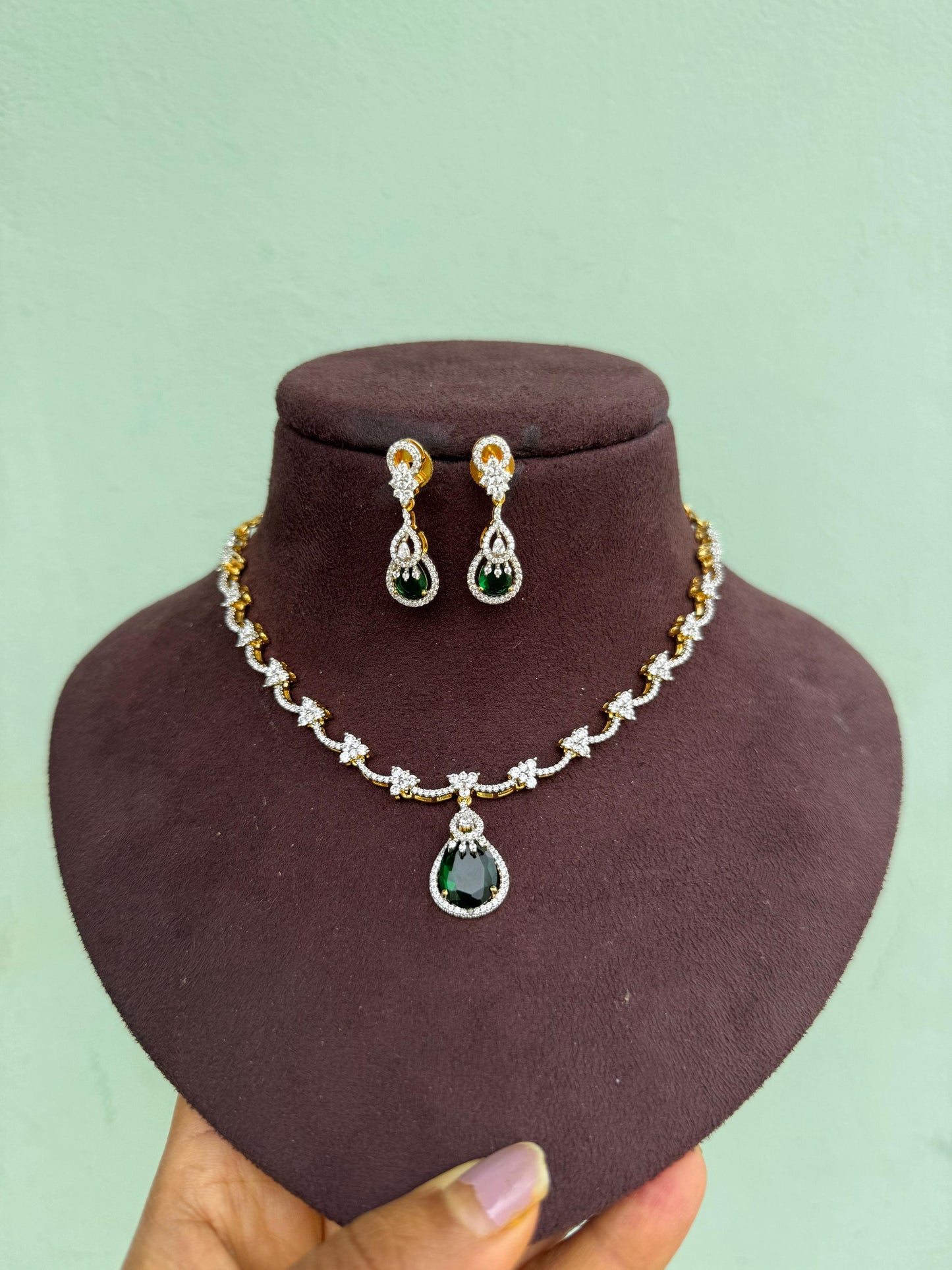 Stylish three stone triangle green drop diamond necklace