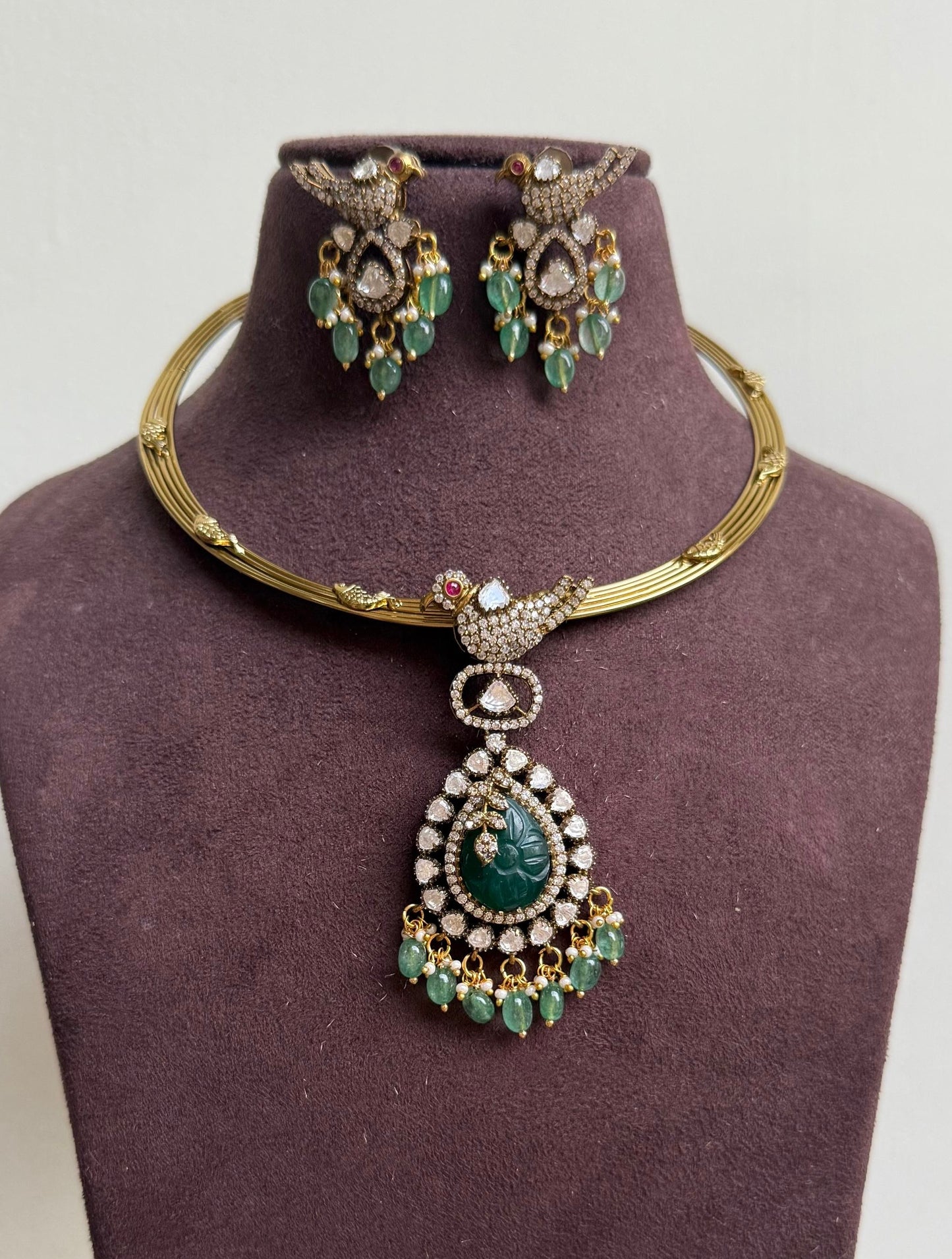 Parrot embossed hasli with locket and matching earrings