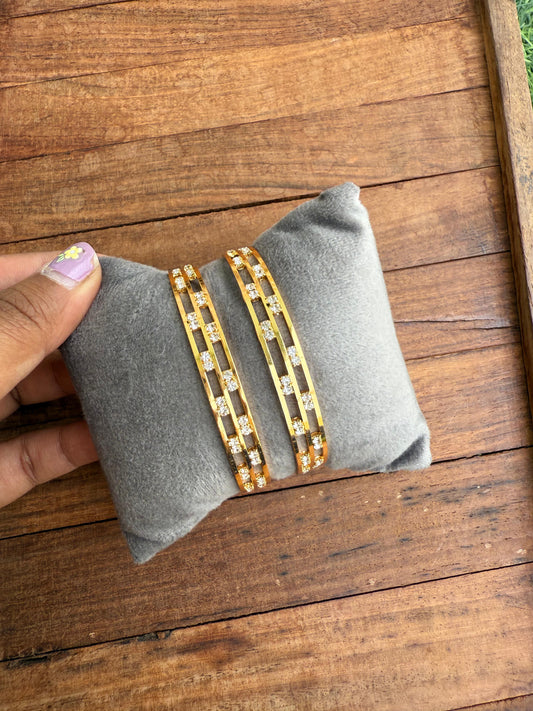 Gold plated sleek stone bangles