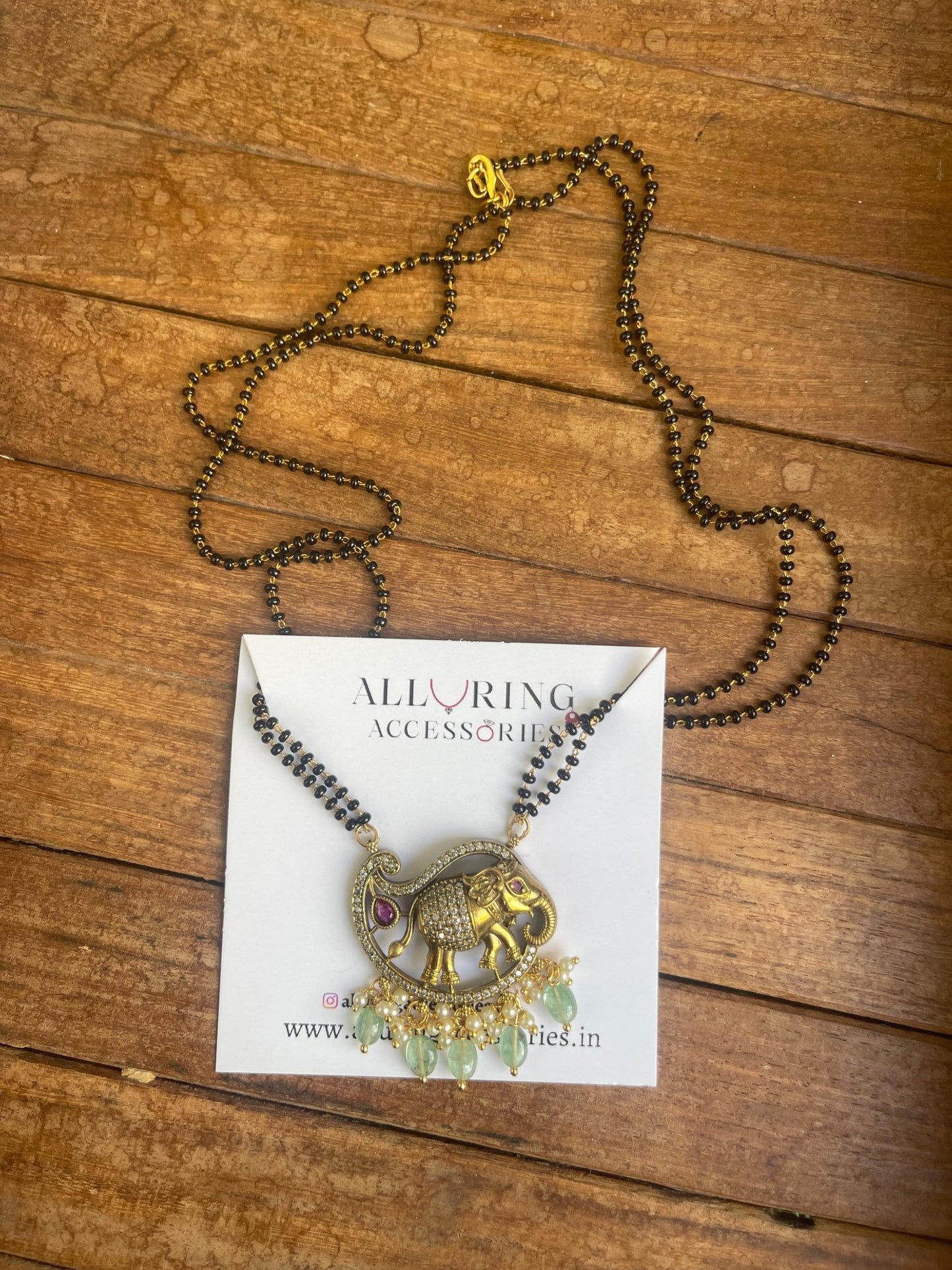 Mango shaped elephant two layered black beads - Alluring Accessories