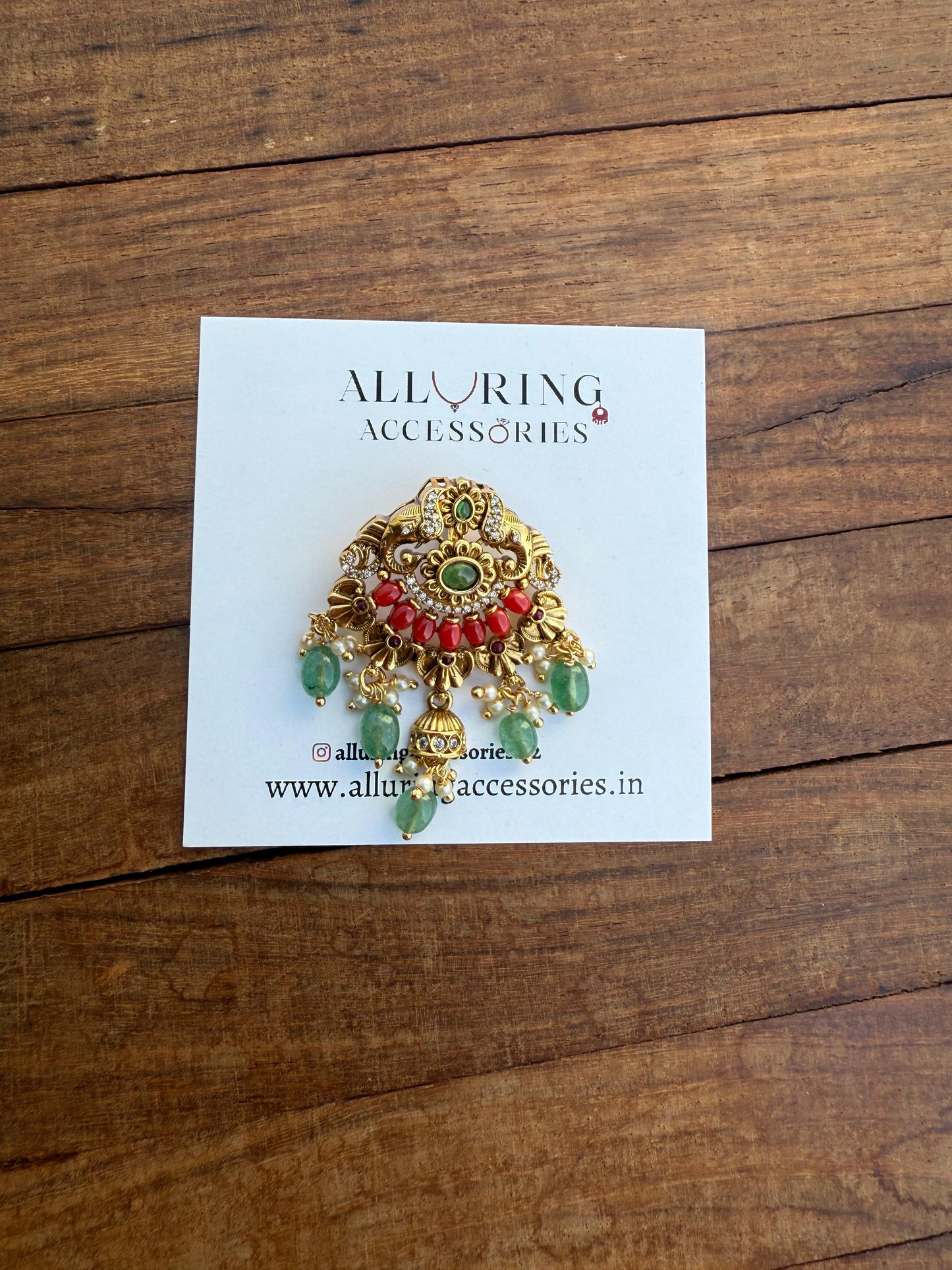 Dual elephant coral locket