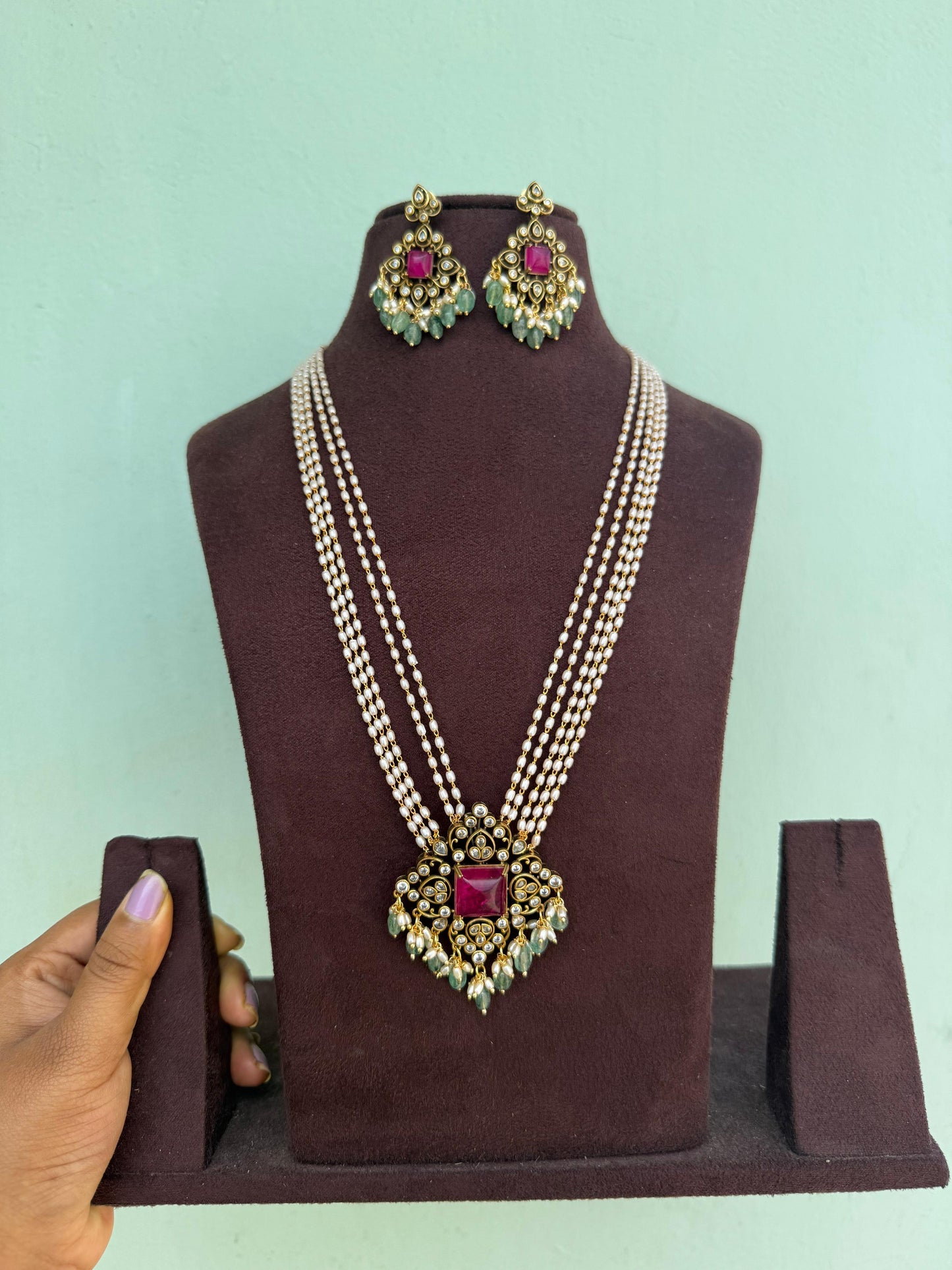 Five layered rice pearl mala diamond shape locket with matching earrings