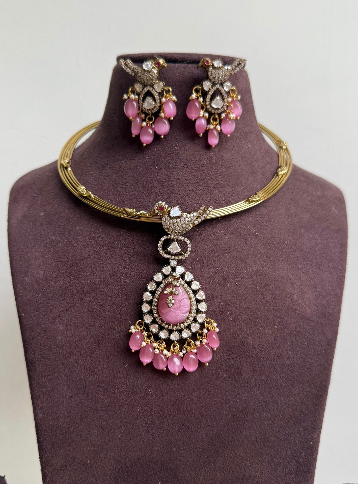 Parrot embossed hasli with locket and matching earrings