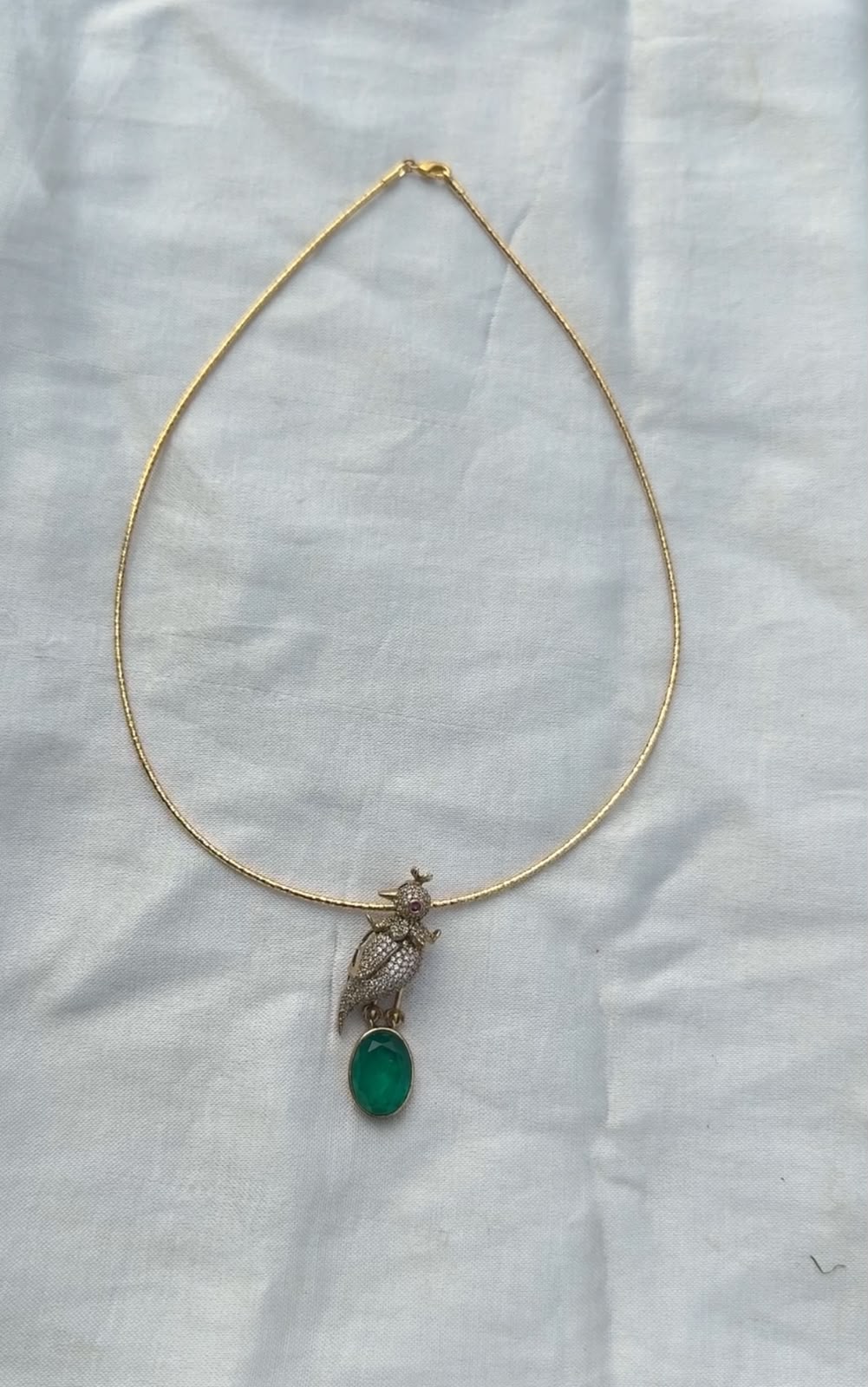Full of stones Parrot emerald locket