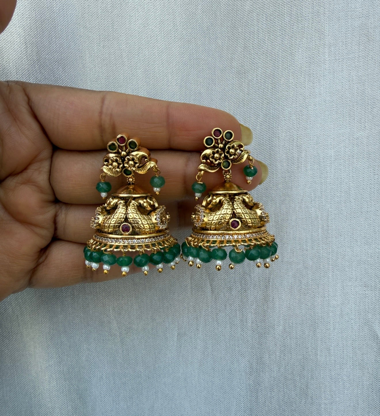 Gold look alike peacock engraved antique cute jhumkas