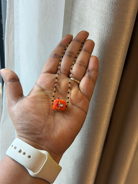 Square coral kundan locket gold and black beads necklace