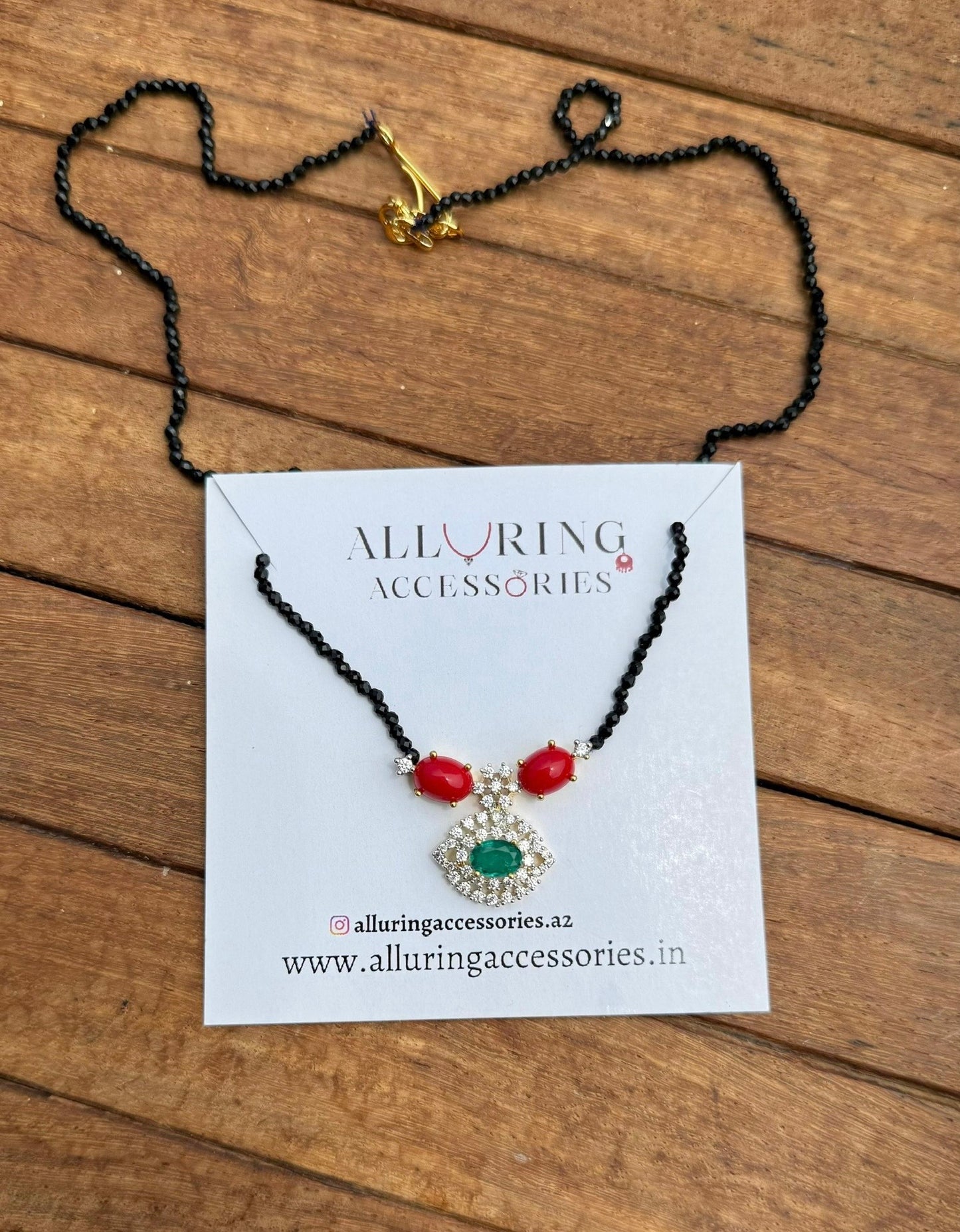 Coral drop pastel green black beads necklace