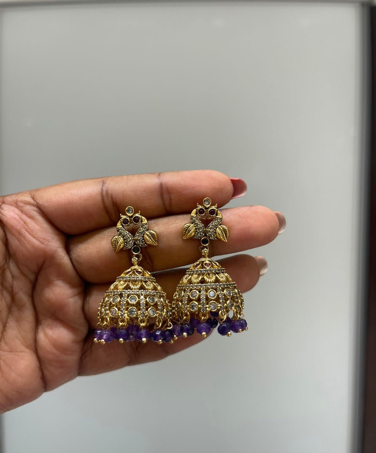 Dual peacock gold jhumkas - Alluring Accessories