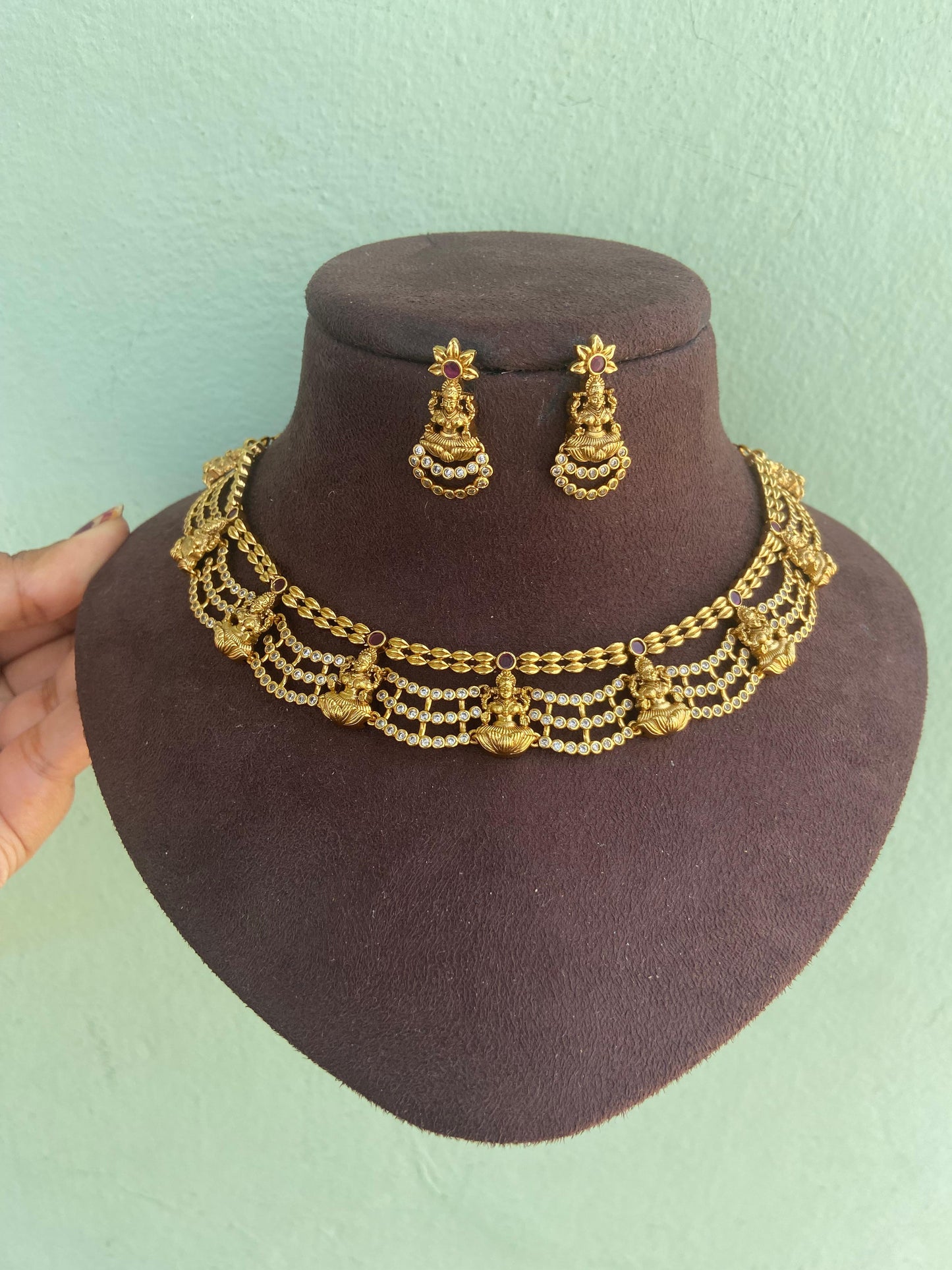 Four layered lakshmi devi antique necklace with earrings