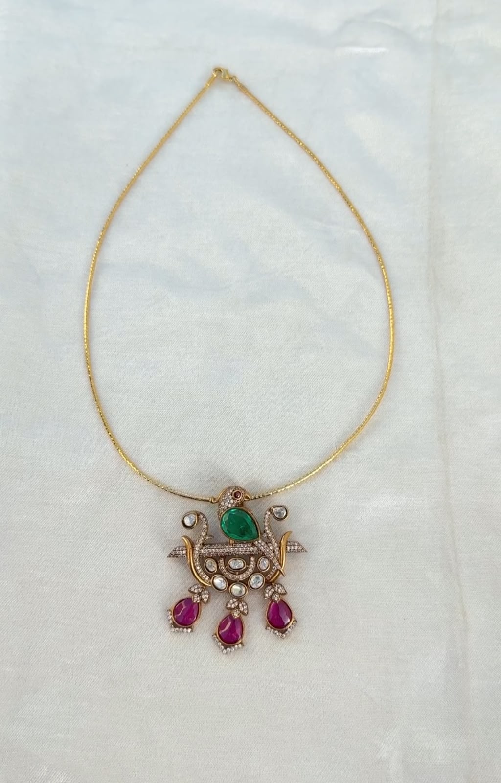 Designer diamond look alike parrot three drop victorian locket