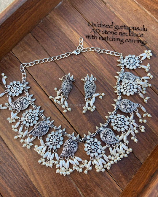 Silver lookalike AD stone guttapusalu necklace with matching earrings - Alluring Accessories
