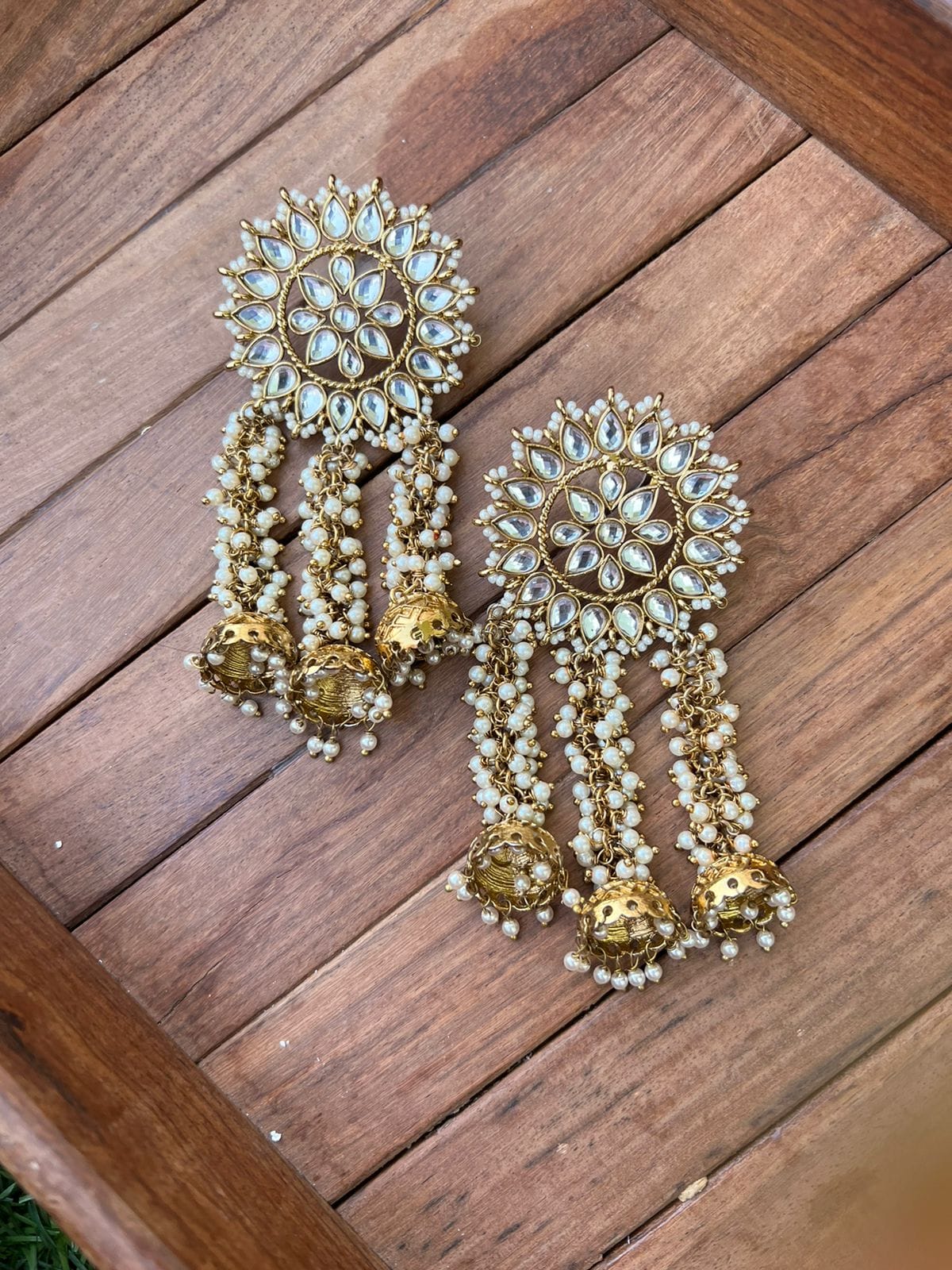 Three pearl hanging kundan earrings